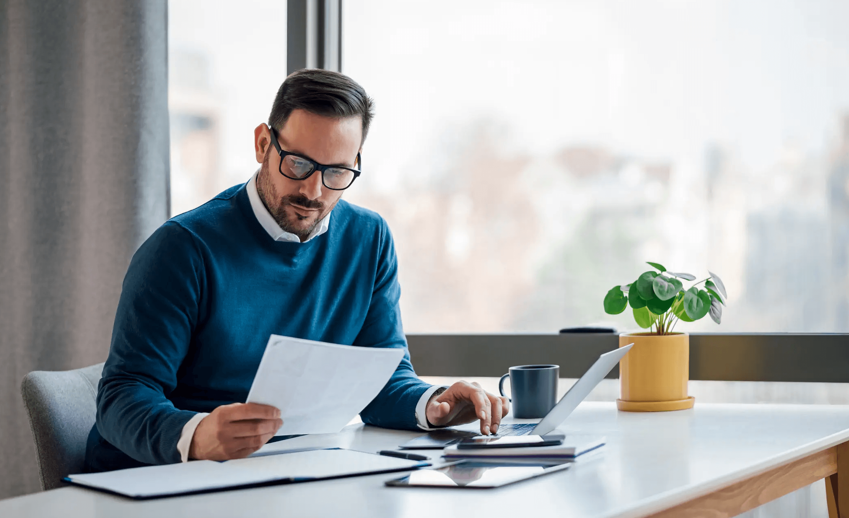Business owner exploring AI technology on laptop